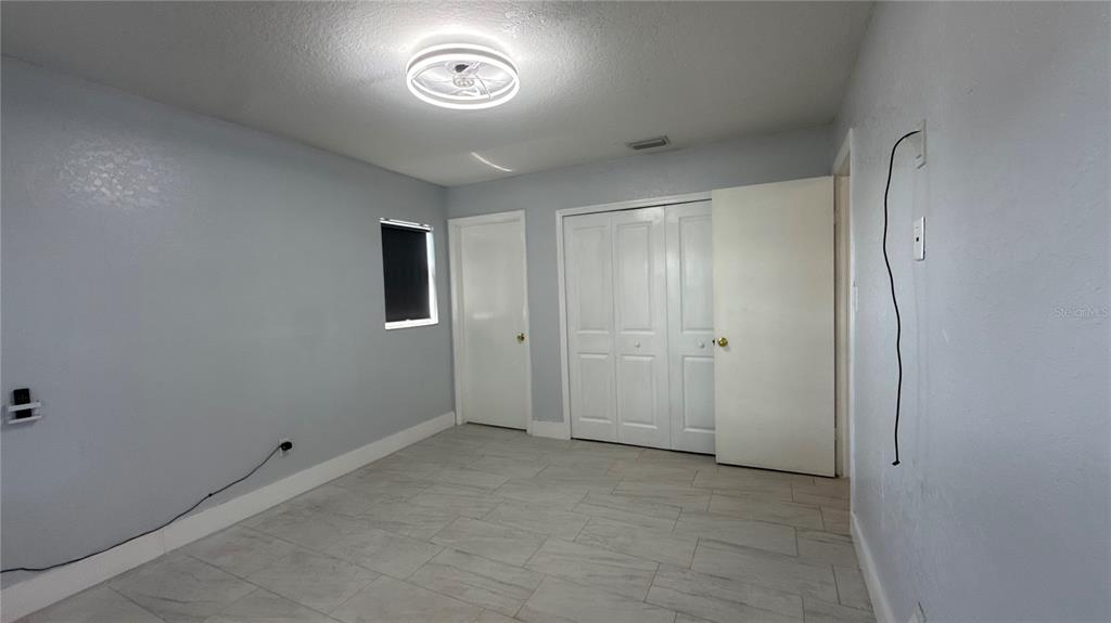 8106 Wichita Way Tampa, FL 33619 - Photo 10 of 21 a view of an empty room
