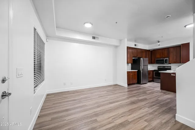 a view of kitchen with wooden floor