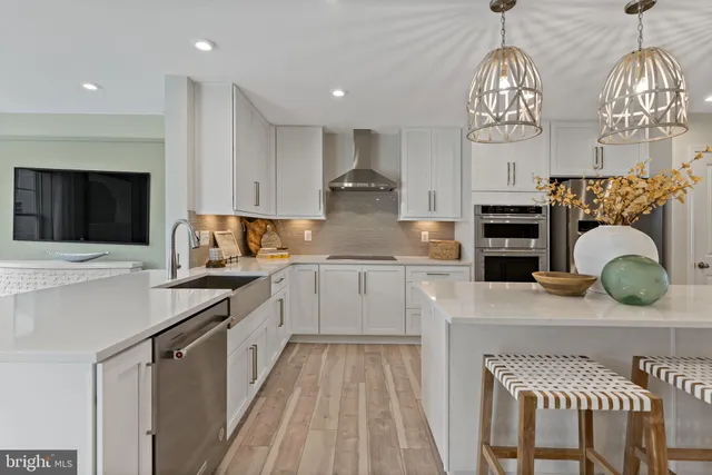 a kitchen with stainless steel appliances granite countertop a sink and cabinets