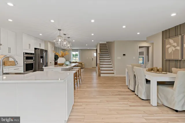 a view of kitchen with cabinets and wooden floor