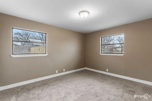 a view of room with window and hallway