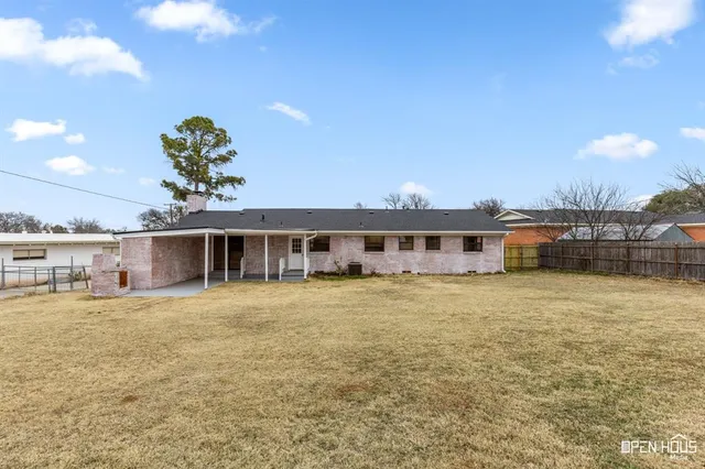 a large white house with a large pool