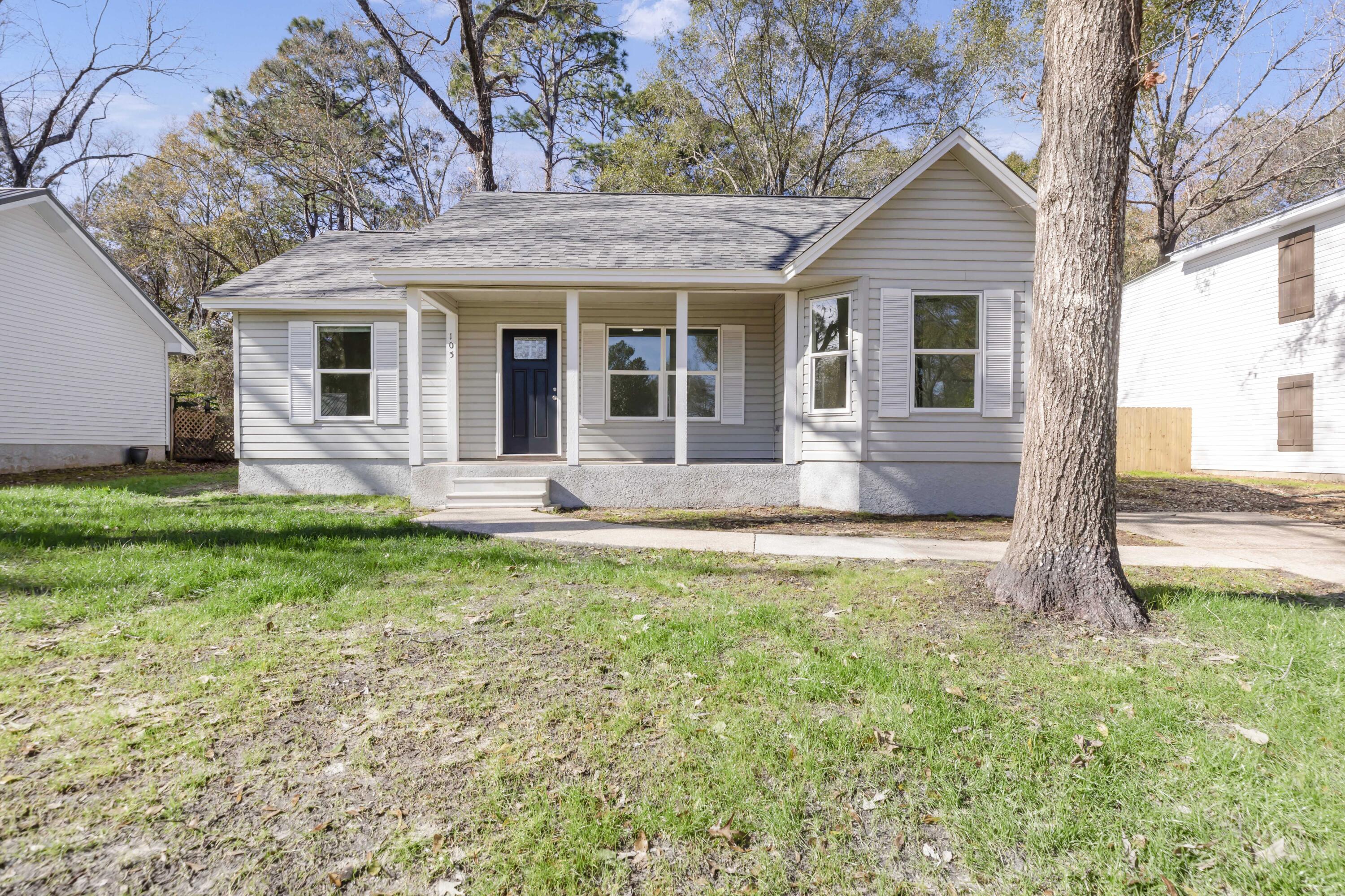 105 Beacons Bend Road Crestview, FL 32536 - Photo 1 of 52 a front view of house with yard and outdoor seating