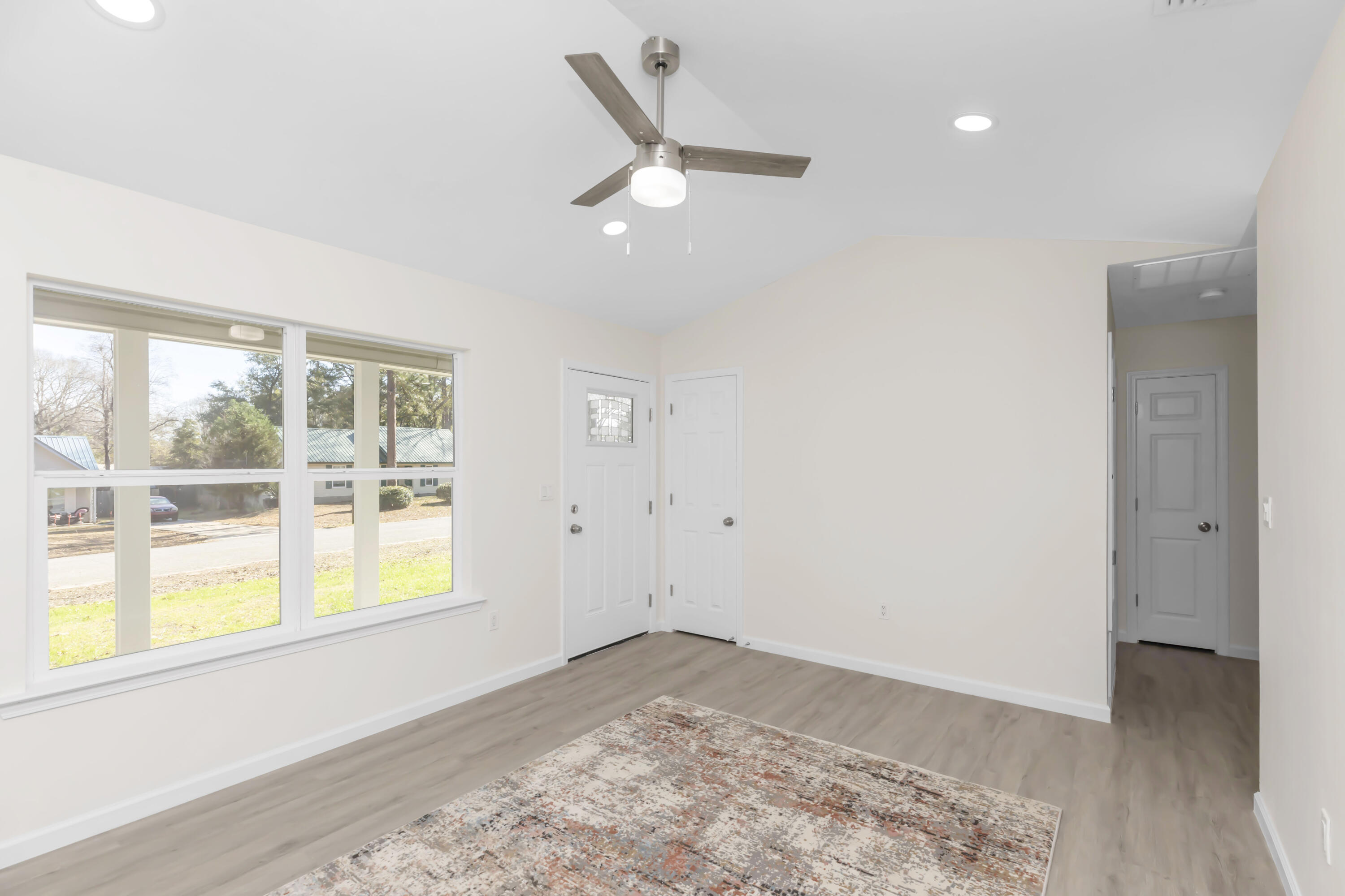 105 Beacons Bend Road Crestview, FL 32536 - Photo 13 of 52 a view of a livingroom with a ceiling fan and window