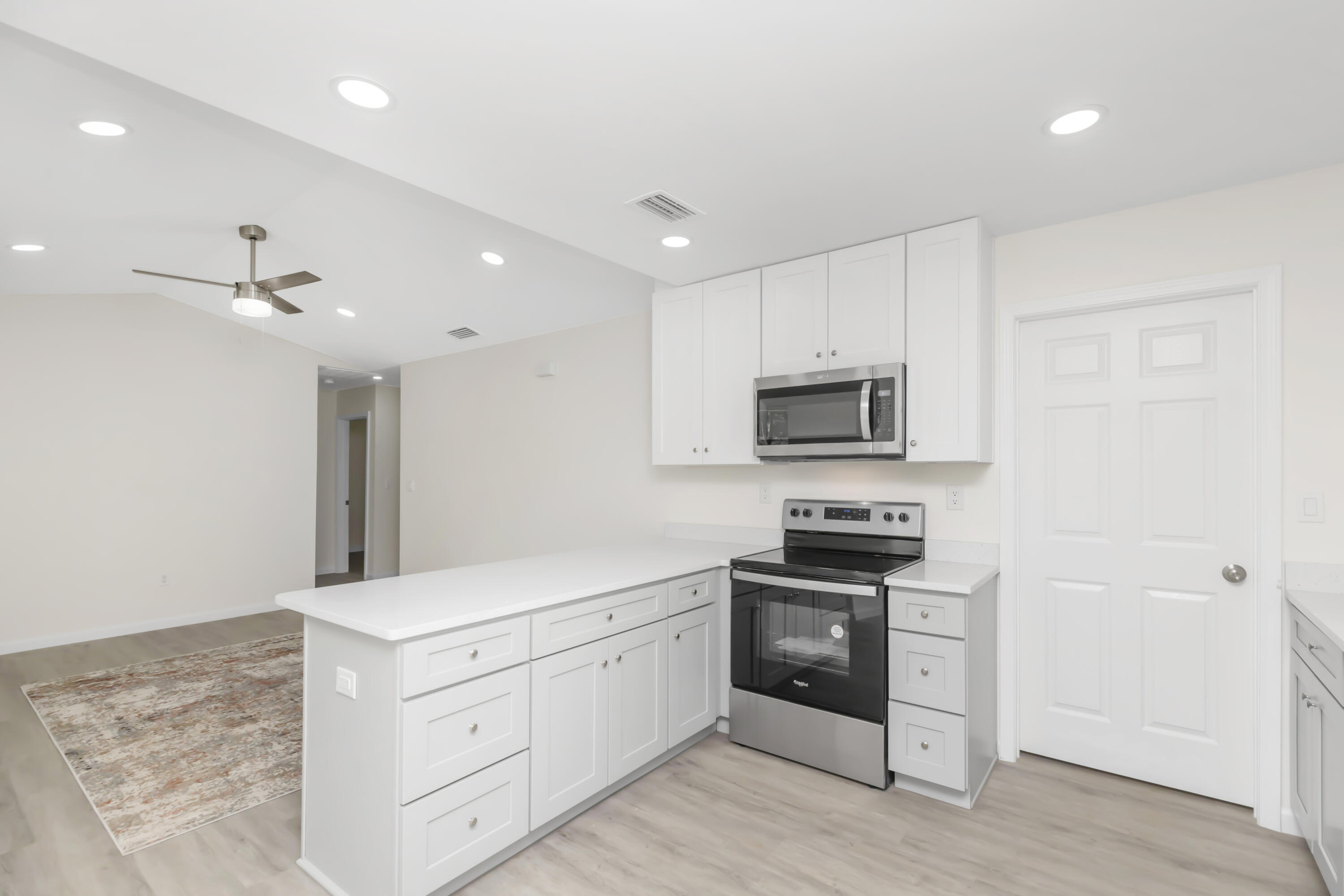 105 Beacons Bend Road Crestview, FL 32536 - Photo 15 of 52 a kitchen with stainless steel appliances granite countertop a stove a sink and a refrigerator