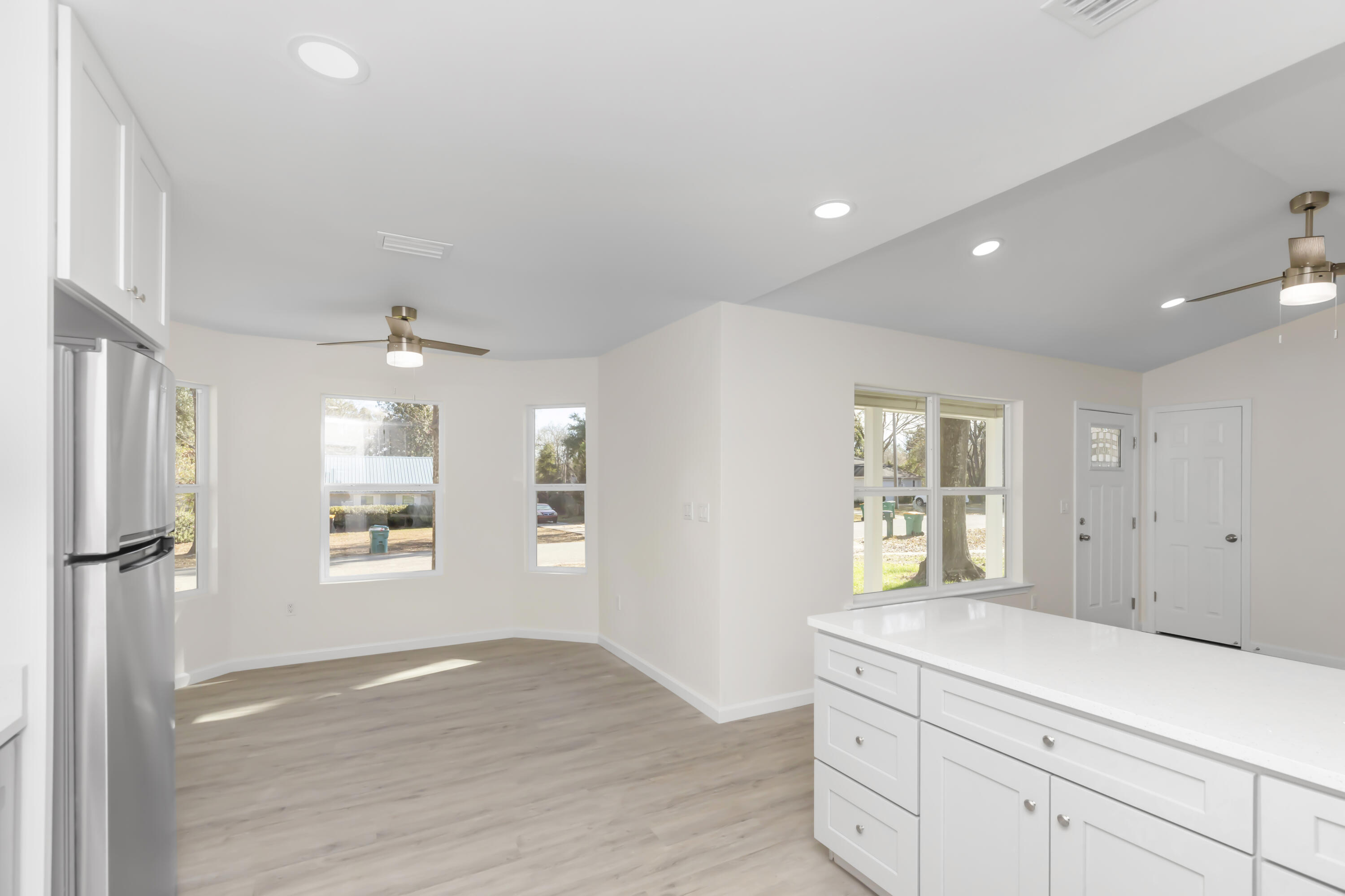 105 Beacons Bend Road Crestview, FL 32536 - Photo 17 of 52 a view of a kitchen cabinets and windows