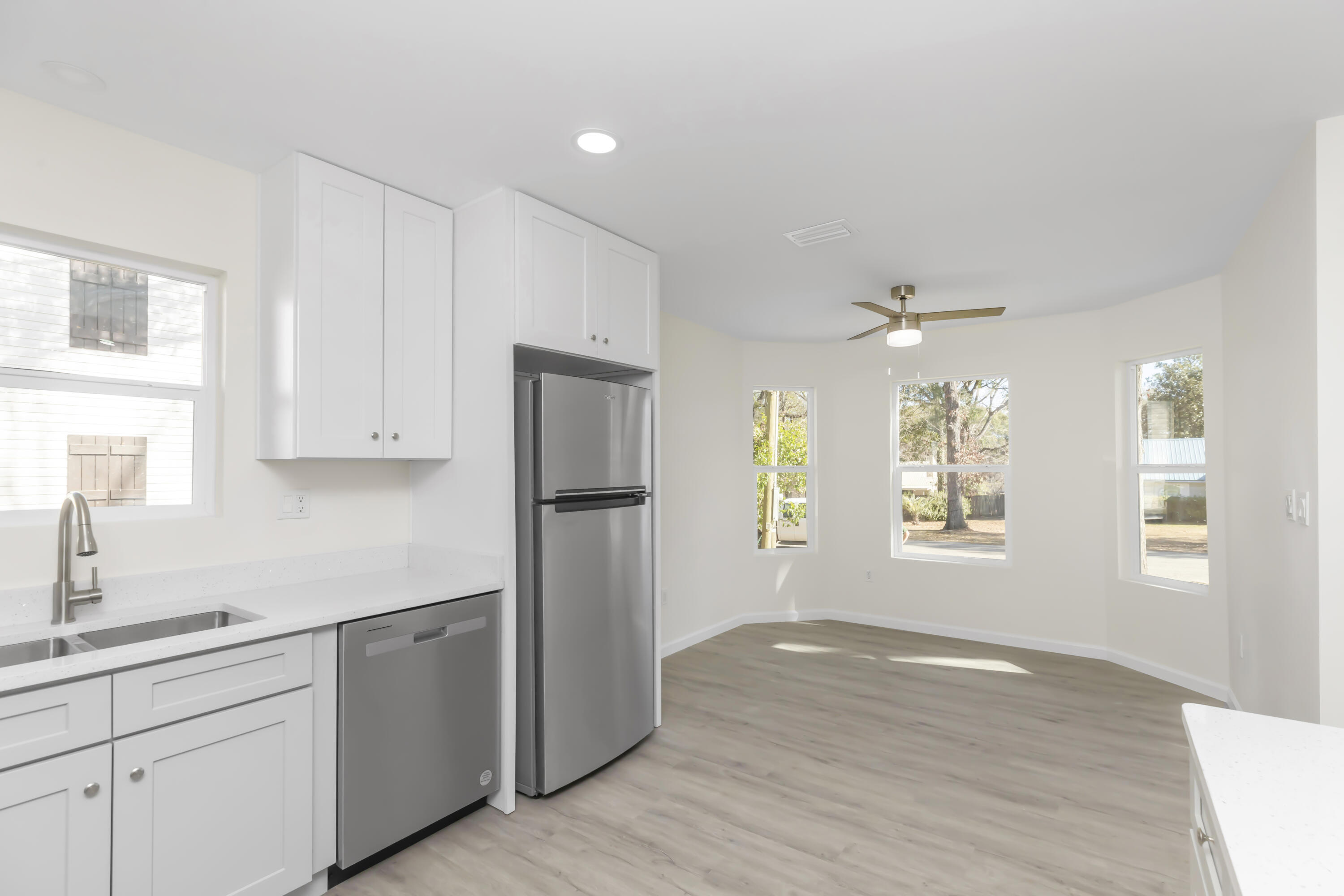105 Beacons Bend Road Crestview, FL 32536 - Photo 18 of 52 a kitchen with a refrigerator and window
