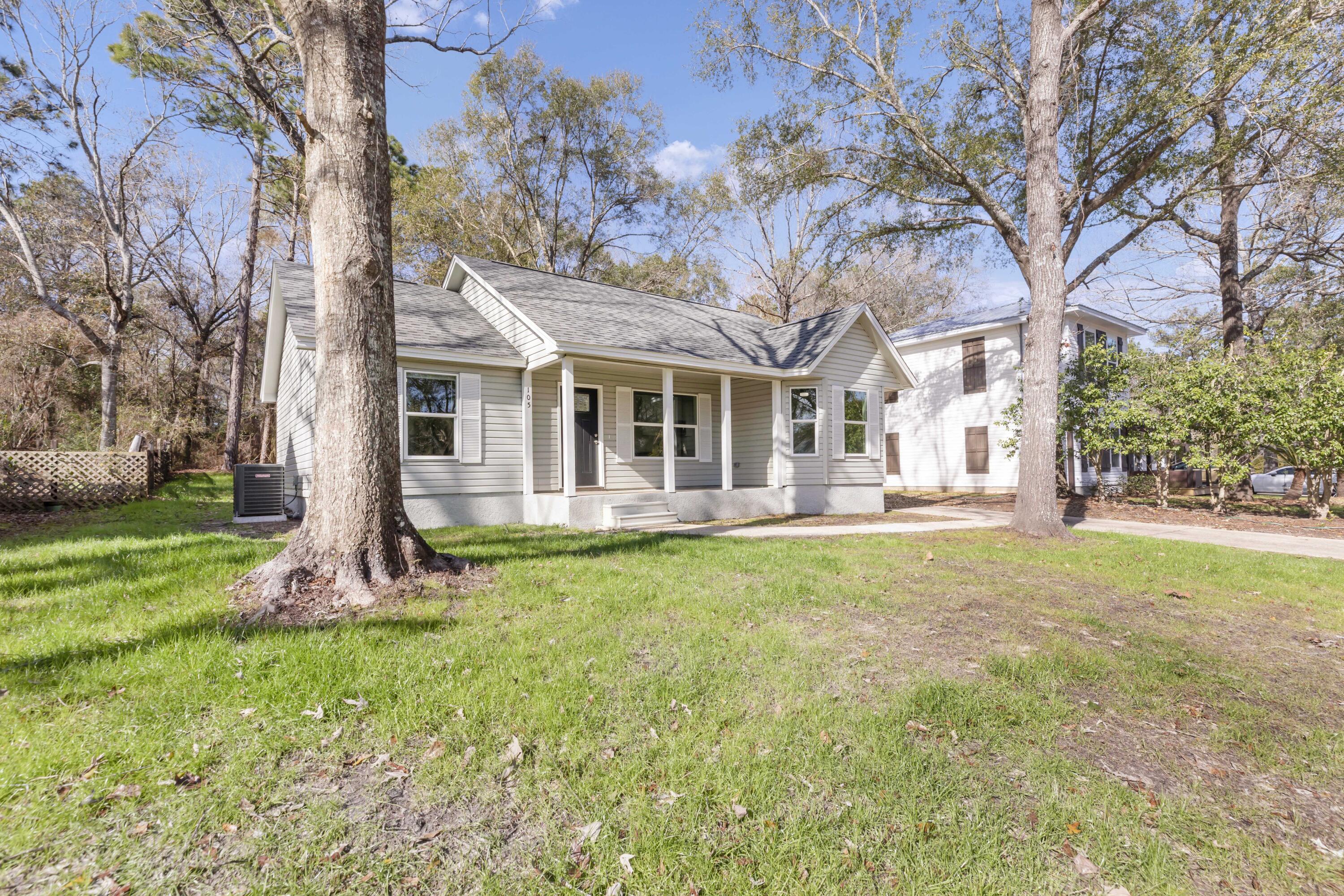 105 Beacons Bend Road Crestview, FL 32536 - Photo 2 of 52 a front view of house with yard and green space