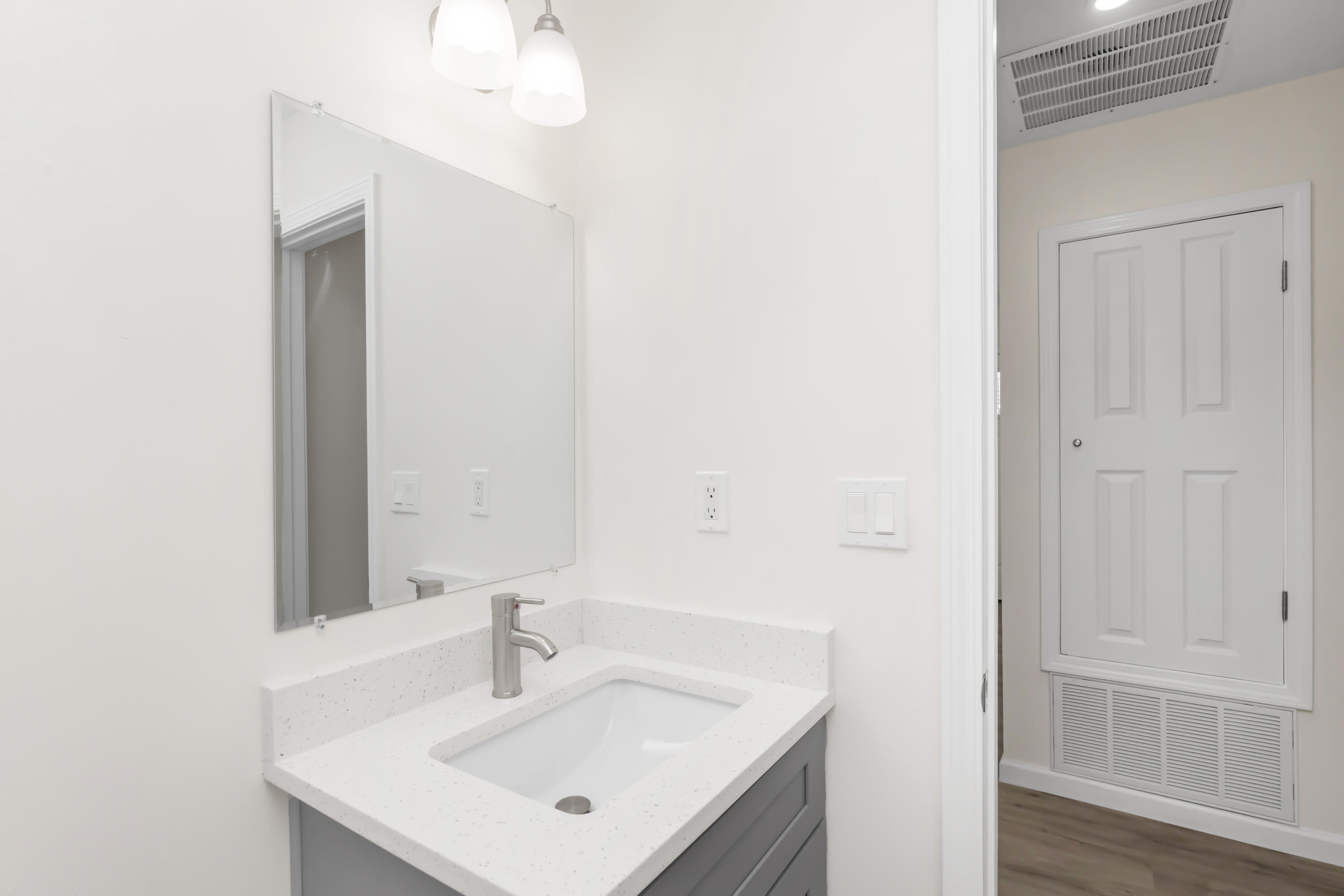 105 Beacons Bend Road Crestview, FL 32536 - Photo 33 of 52 a bathroom with a sink and a mirror