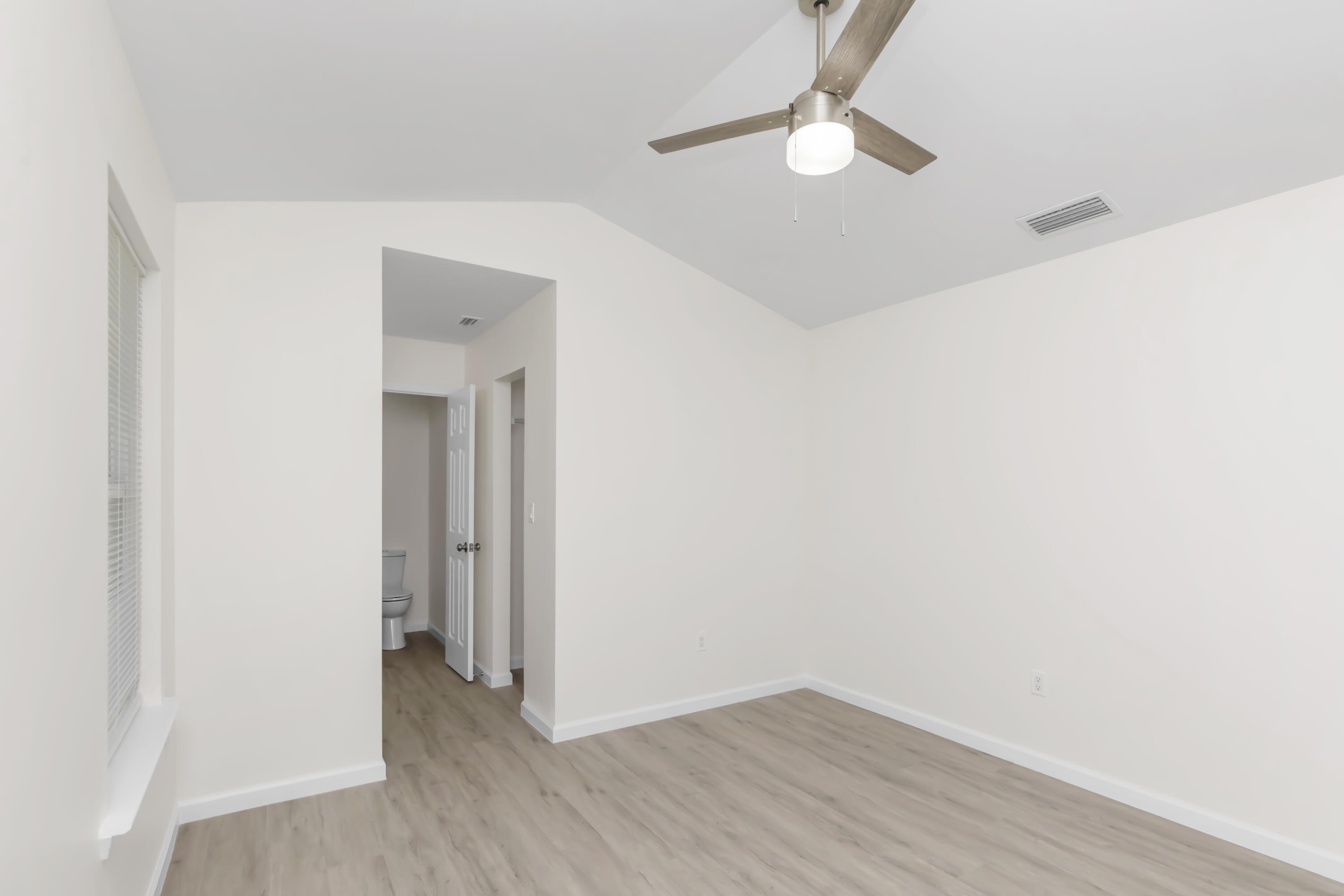 105 Beacons Bend Road Crestview, FL 32536 - Photo 36 of 52 a view of an empty room with wooden floor