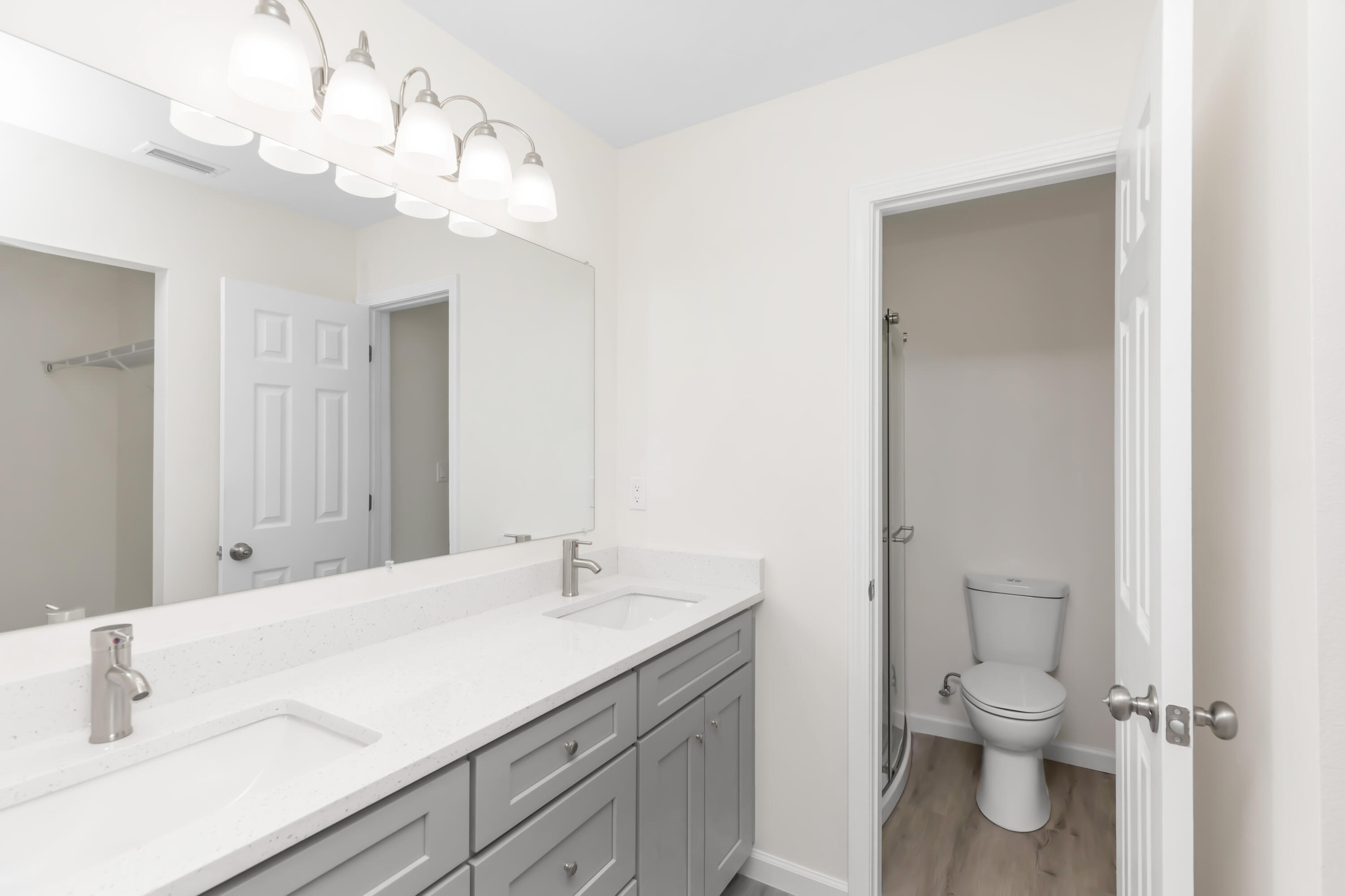 105 Beacons Bend Road Crestview, FL 32536 - Photo 41 of 52 a bathroom with a granite countertop sink a toilet and a mirror