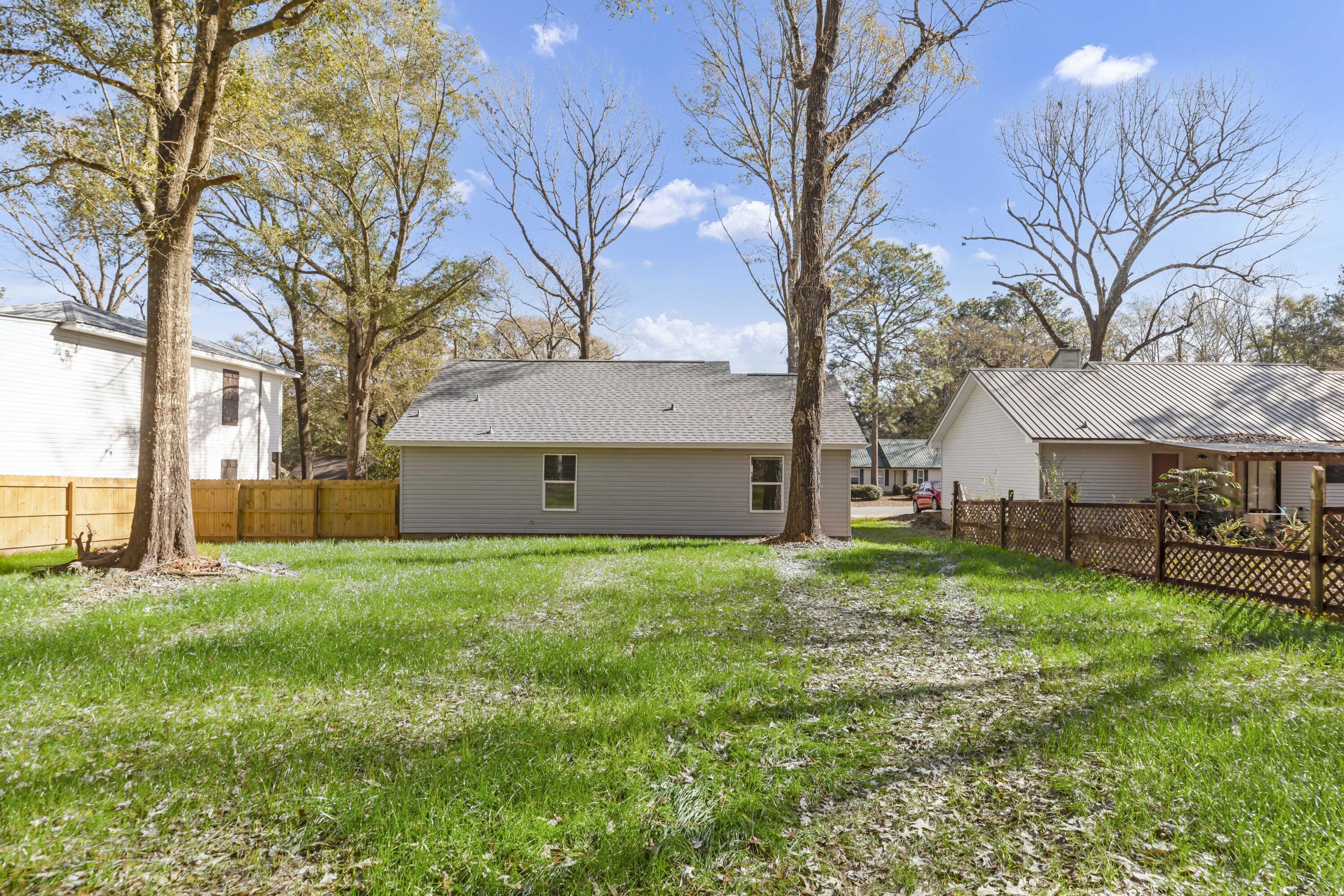 105 Beacons Bend Road Crestview, FL 32536 - Photo 47 of 52 a view of a house with a yard