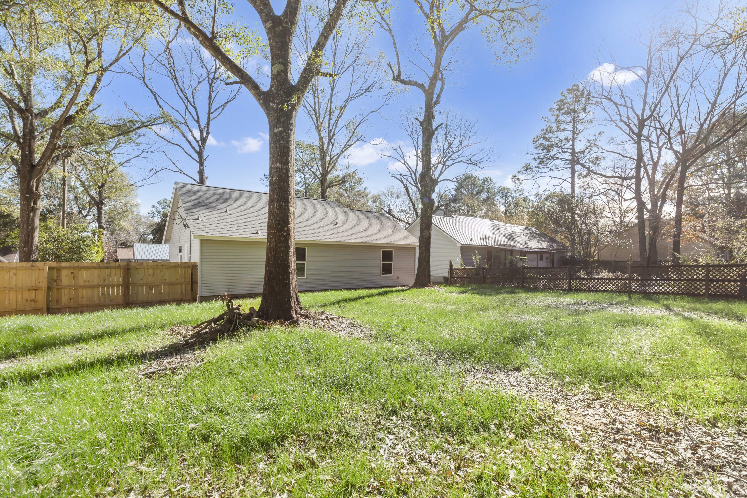 105 Beacons Bend Road Crestview, FL 32536 - Photo 48 of 52 a view of backyard with tree