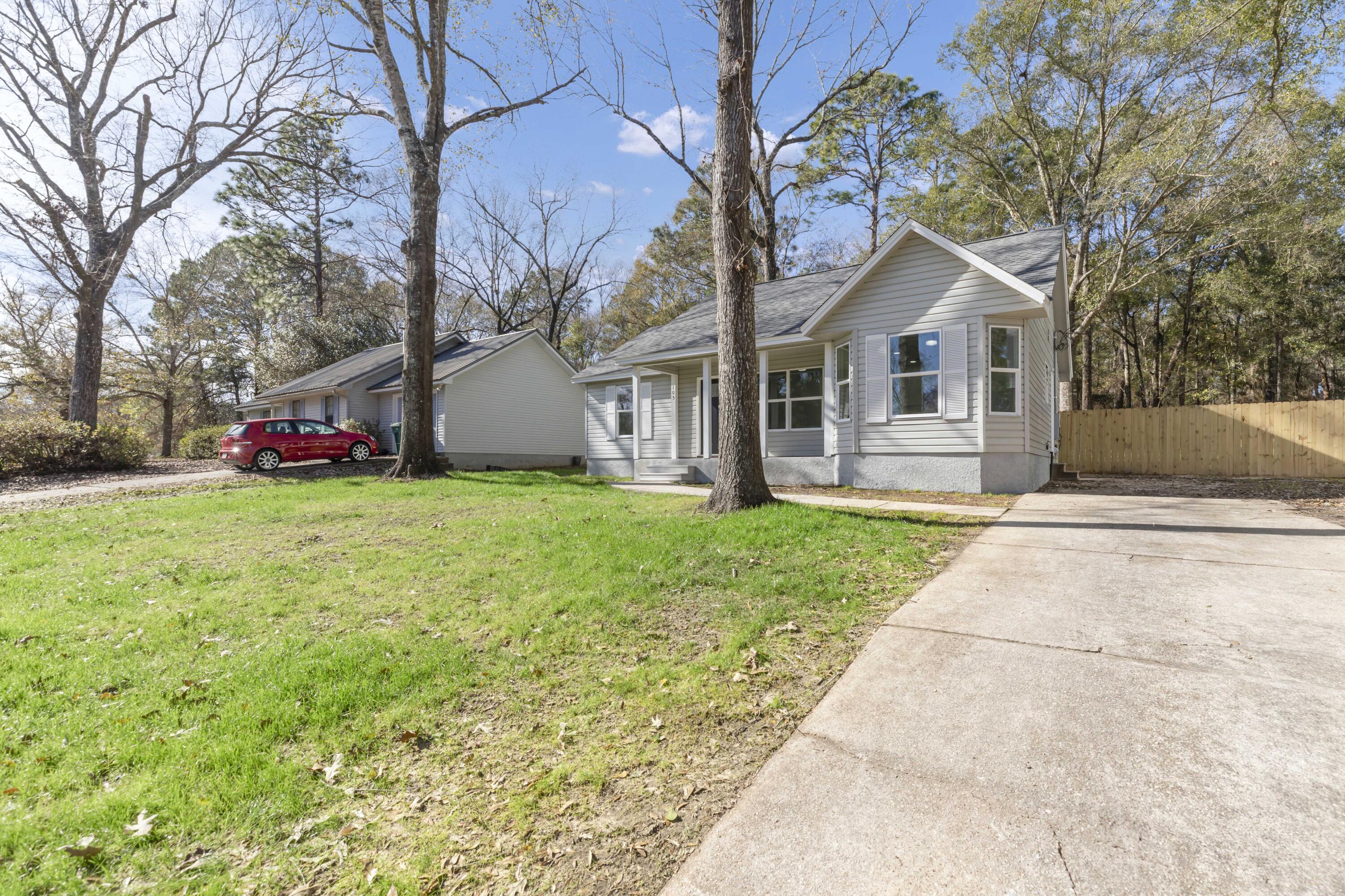 105 Beacons Bend Road Crestview, FL 32536 - Photo 50 of 52 a front view of house with yard and green space