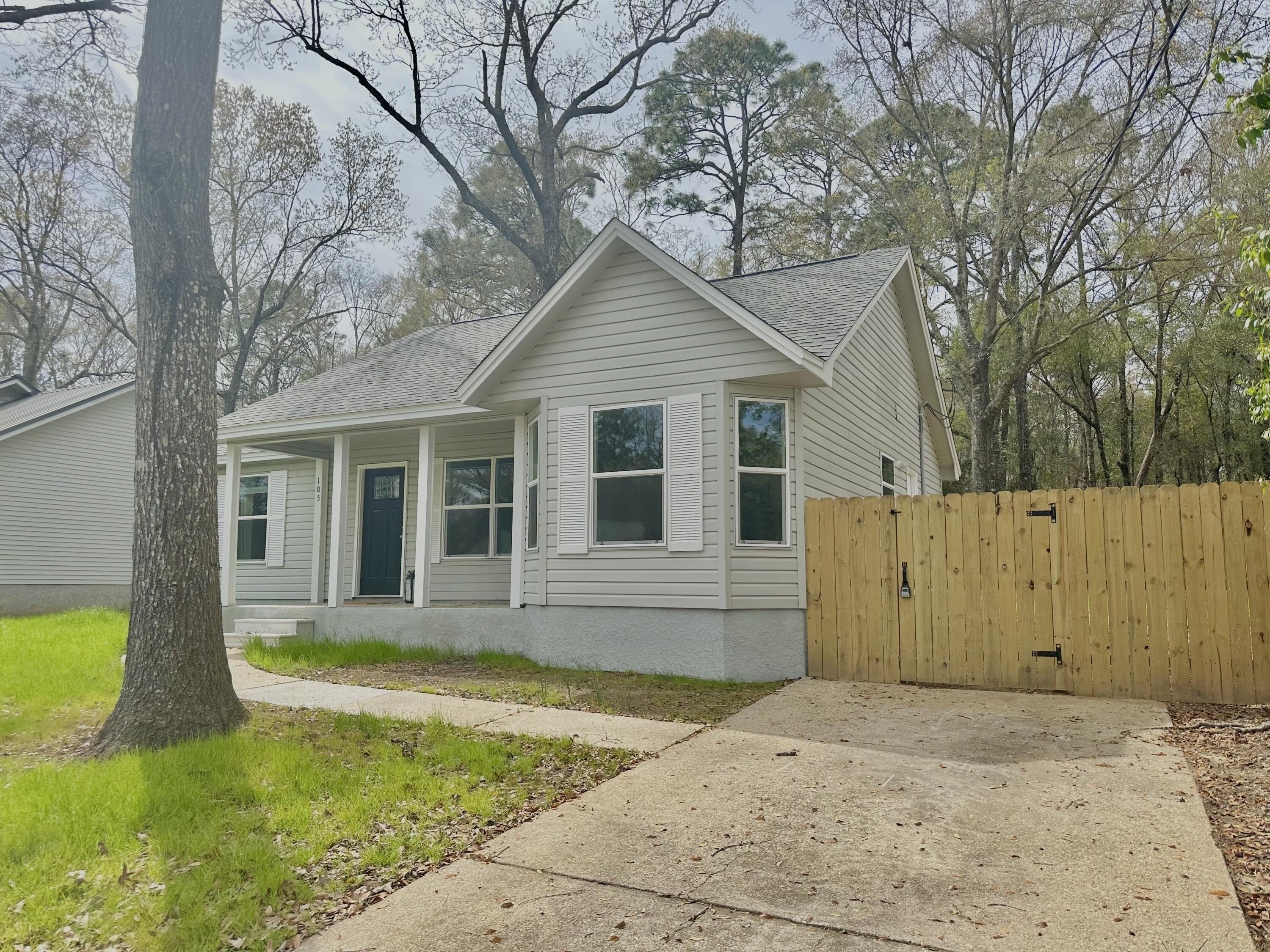 105 Beacons Bend Road Crestview, FL 32536 - Photo 52 of 52 a house that has a large tree in front of it