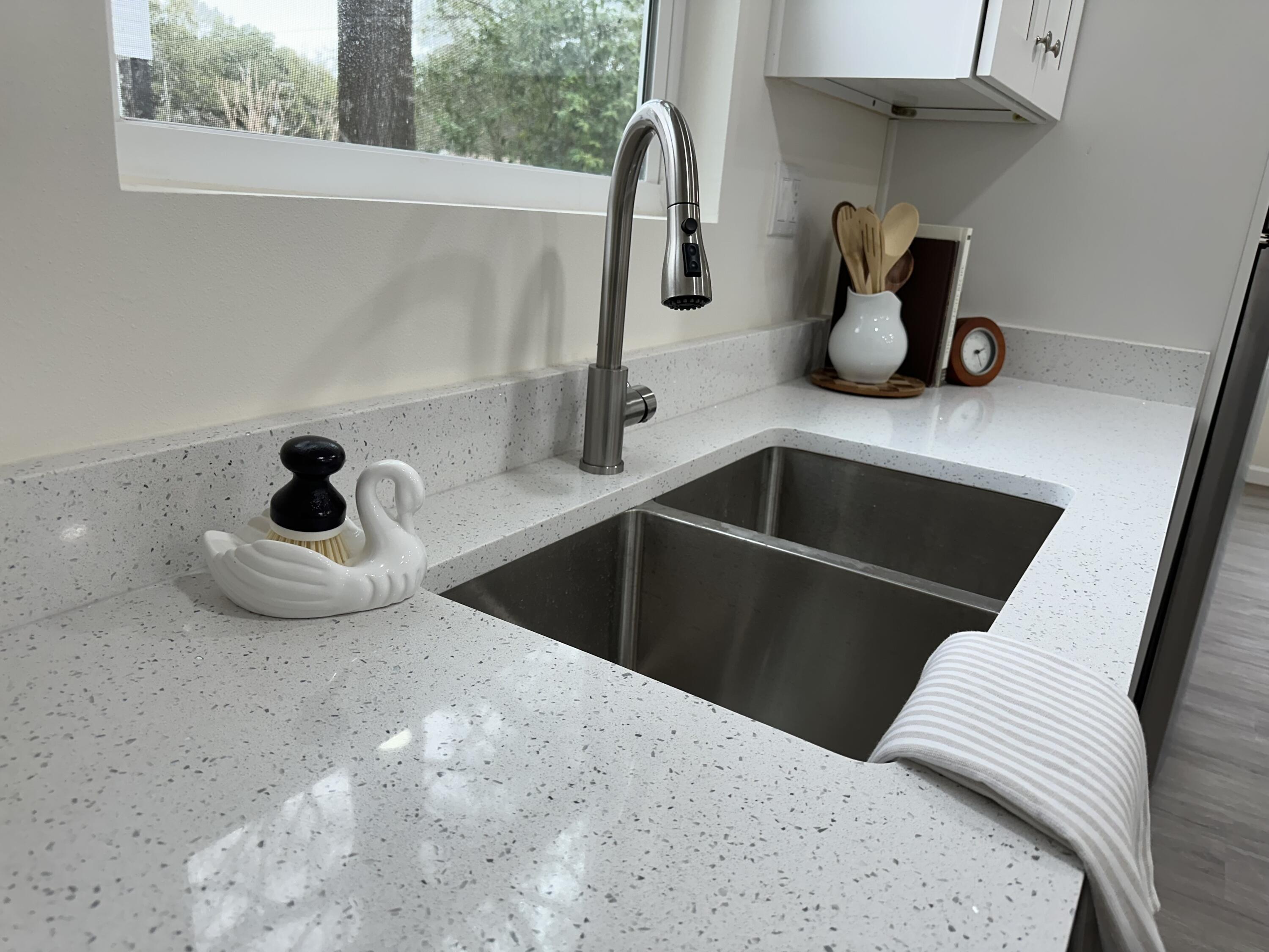 105 Beacons Bend Road Crestview, FL 32536 - Photo 6 of 52 a kitchen with a sink and a window