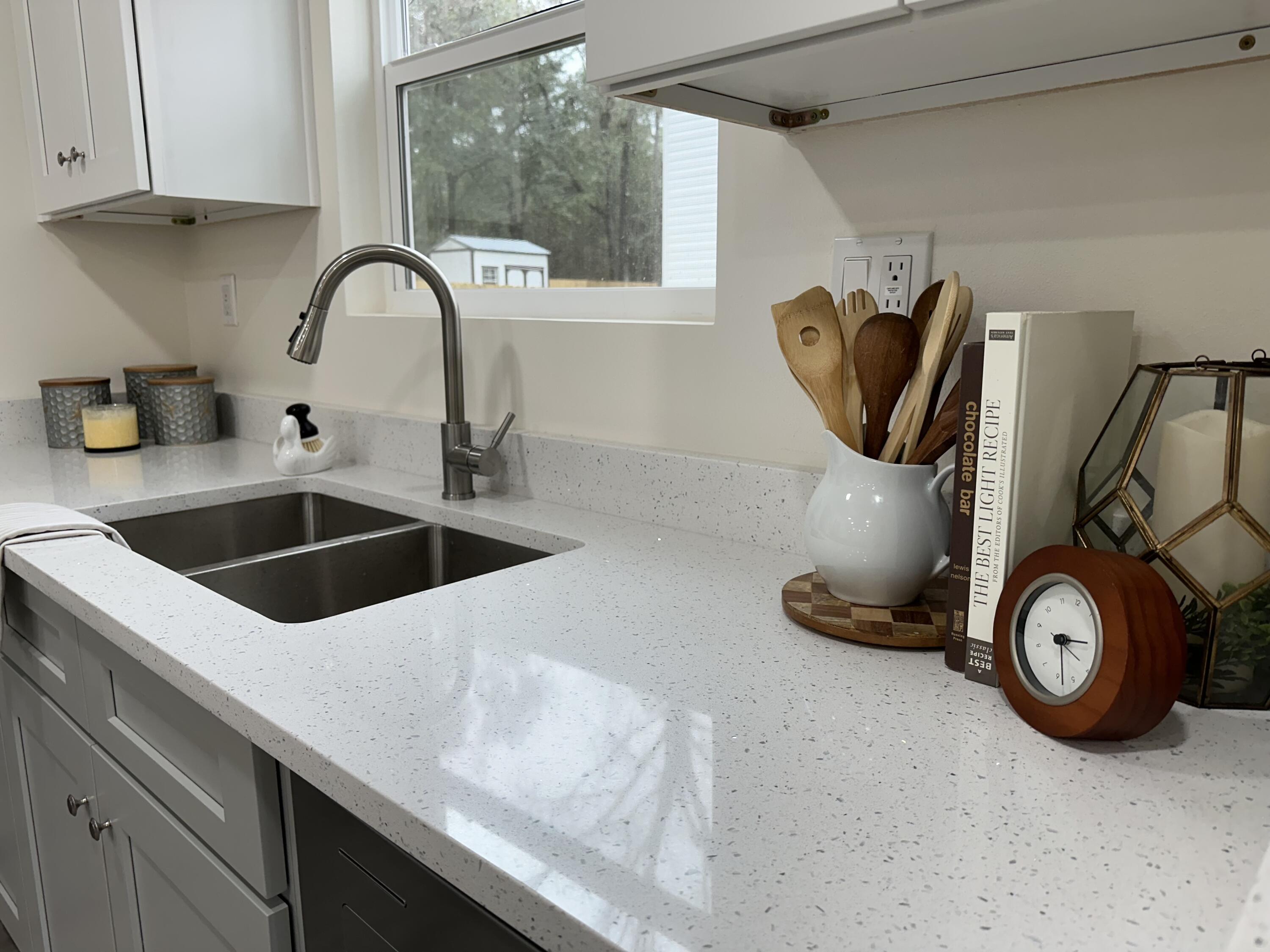 105 Beacons Bend Road Crestview, FL 32536 - Photo 7 of 52 a kitchen with a sink and a stove top oven
