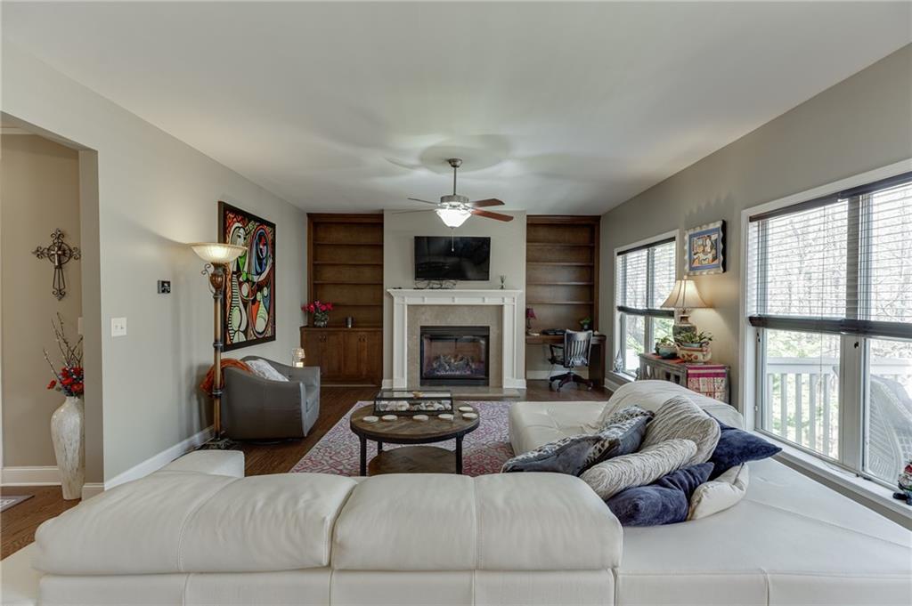 2201 Spring Sound Lane Buford, GA 30519 - Photo 11 of 66 a living room with furniture and a fireplace