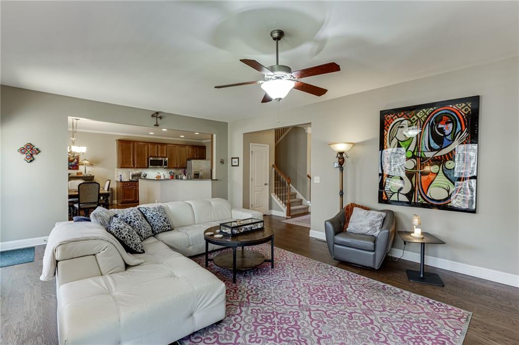 2201 Spring Sound Lane Buford, GA 30519 - Photo 14 of 66 a living room with furniture and a chandelier