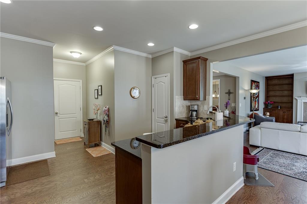 2201 Spring Sound Lane Buford, GA 30519 - Photo 18 of 66 a living room with furniture and a flat screen tv