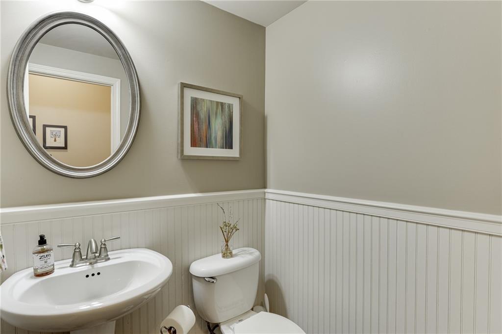 2201 Spring Sound Lane Buford, GA 30519 - Photo 24 of 66 a bathroom with a sink and a mirror