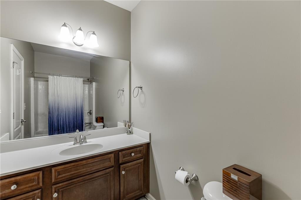 2201 Spring Sound Lane Buford, GA 30519 - Photo 28 of 66 a bathroom with a sink and a mirror
