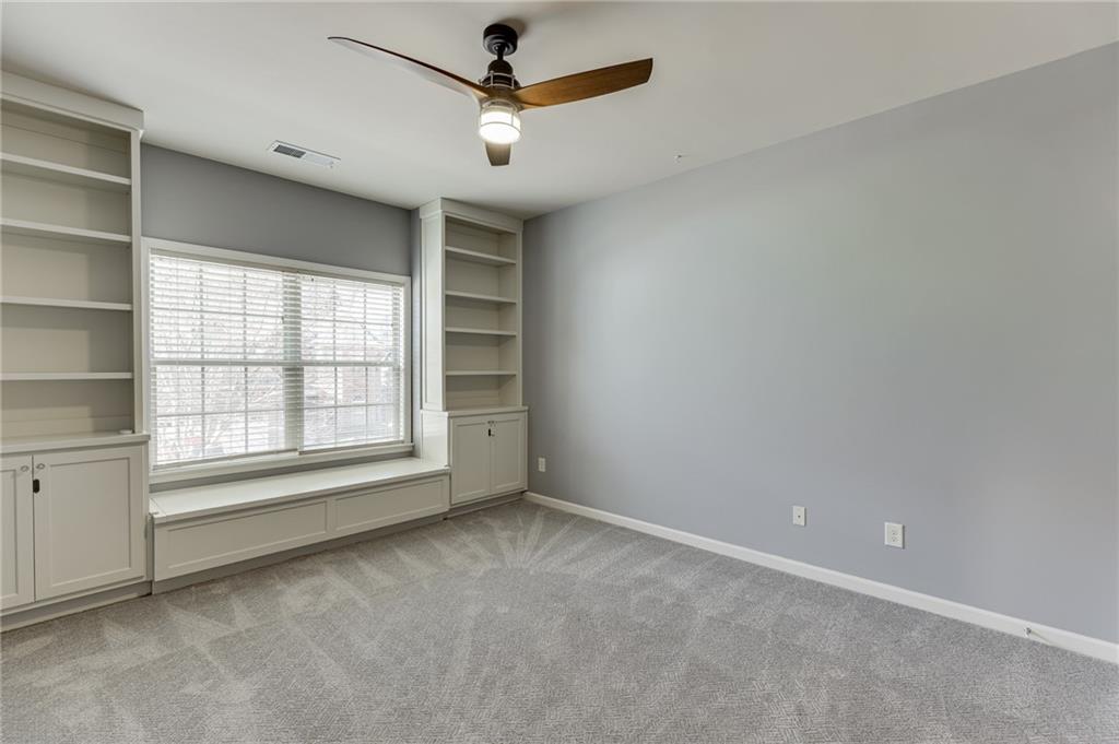 2201 Spring Sound Lane Buford, GA 30519 - Photo 29 of 66 an empty room with a empty space and a ceiling fan