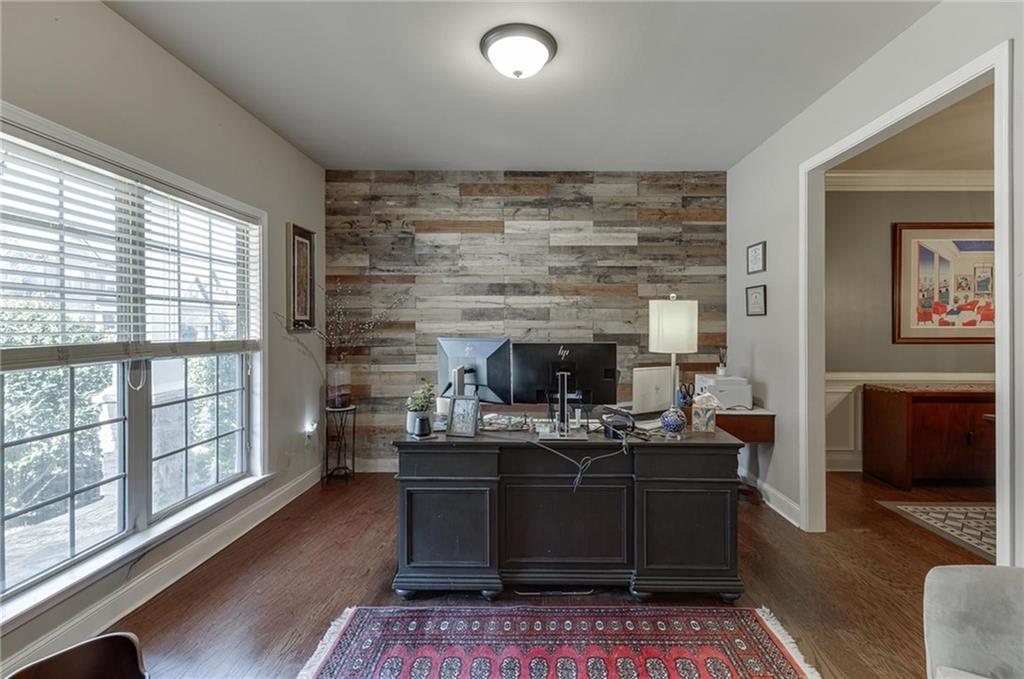 2201 Spring Sound Lane Buford, GA 30519 - Photo 4 of 66 a living room with furniture a flat screen tv and a fireplace