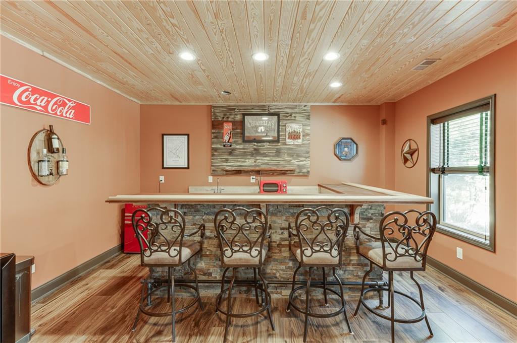 2201 Spring Sound Lane Buford, GA 30519 - Photo 48 of 66 a view of a dining room with furniture window and wooden floor