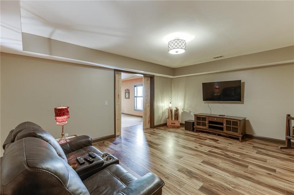 2201 Spring Sound Lane Buford, GA 30519 - Photo 51 of 66 a living room with furniture and a flat screen tv