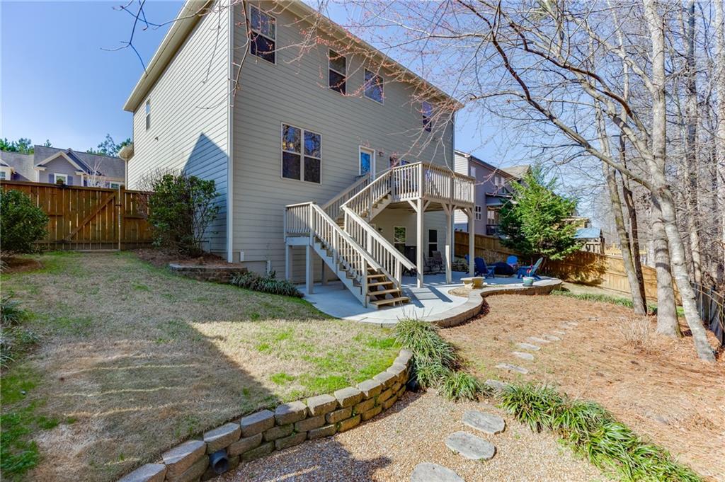 2201 Spring Sound Lane Buford, GA 30519 - Photo 56 of 66 a view of a house with backyard porch and sitting area