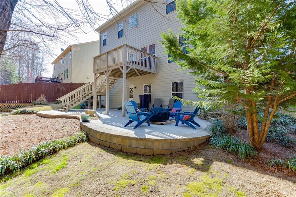 2201 Spring Sound Lane Buford, GA 30519 - Photo 58 of 66 a view of a house with backyard and sitting area
