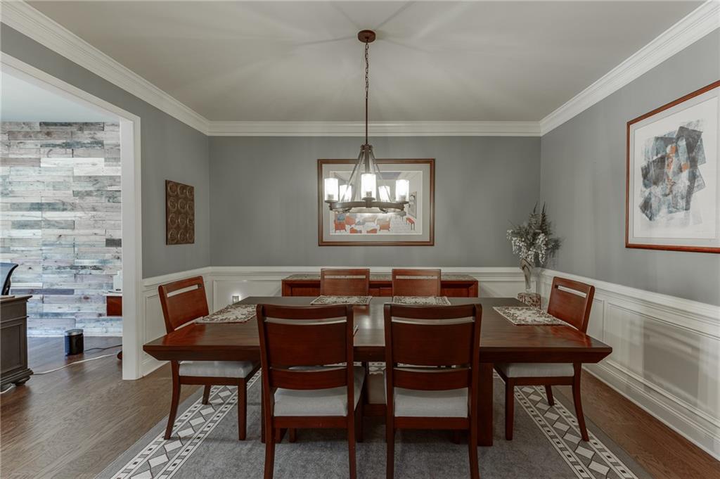 2201 Spring Sound Lane Buford, GA 30519 - Photo 6 of 66 a view of a dining room with furniture window and wooden floor