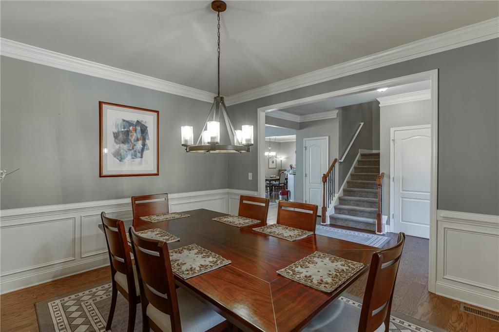2201 Spring Sound Lane Buford, GA 30519 - Photo 8 of 66 a view of a dining room with a table and chairs