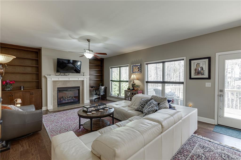2201 Spring Sound Lane Buford, GA 30519 - Photo 10 of 66 a living room with furniture fireplace and flat screen tv