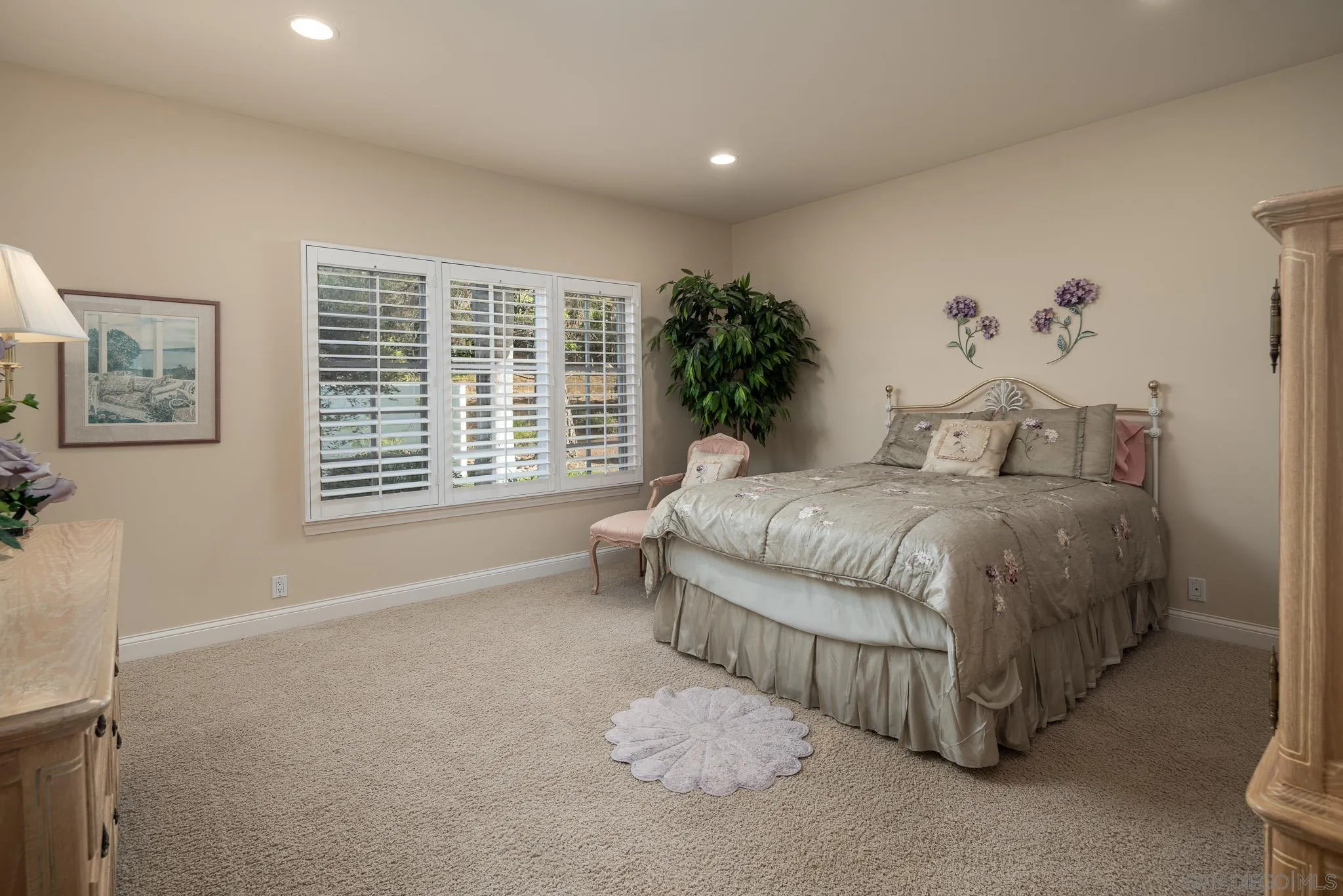 18221 Via Ascenso Rancho Santa Fe, CA 92067 - Photo 23 of 37 a spacious bedroom with a bed and a window