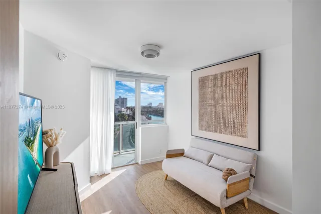 a living room with furniture and a window