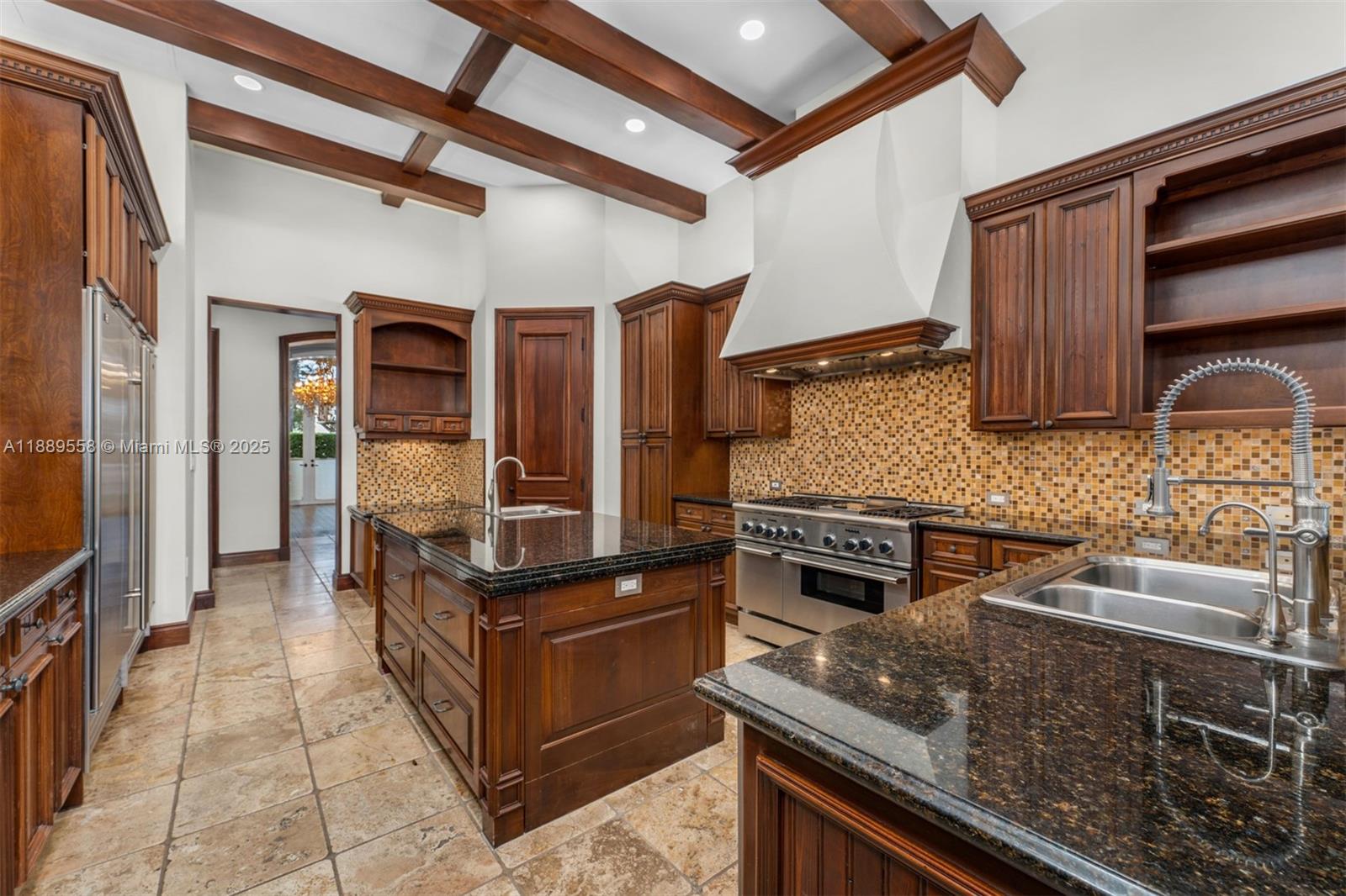 6350 Southwest 92nd Street Pinecrest, FL 33156 - Photo 13 of 41 a kitchen with stainless steel appliances granite countertop a stove and a sink