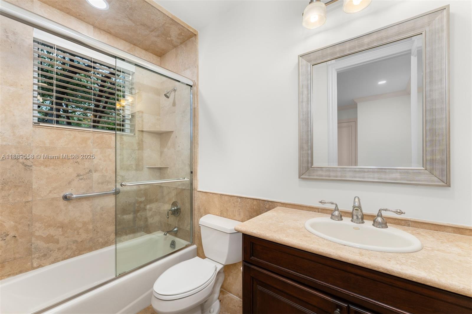6350 Southwest 92nd Street Pinecrest, FL 33156 - Photo 19 of 41 a bathroom with a sink and a mirror
