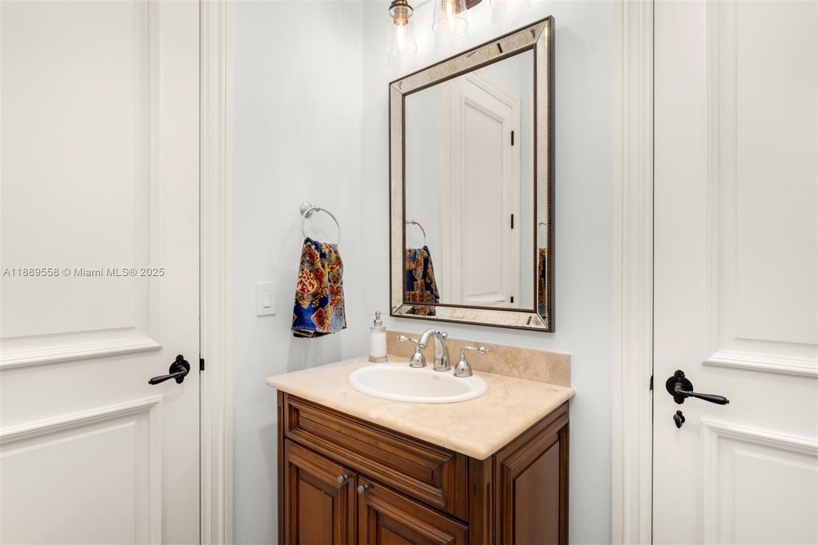 6350 Southwest 92nd Street Pinecrest, FL 33156 - Photo 23 of 41 a bathroom with a sink vanity and a mirror