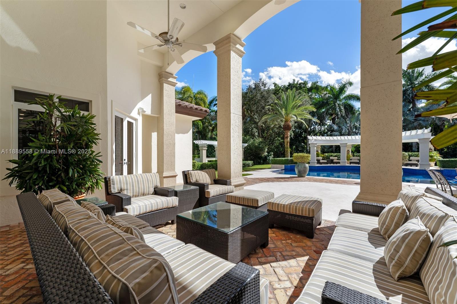 6350 Southwest 92nd Street Pinecrest, FL 33156 - Photo 32 of 41 a living room with furniture and a large window
