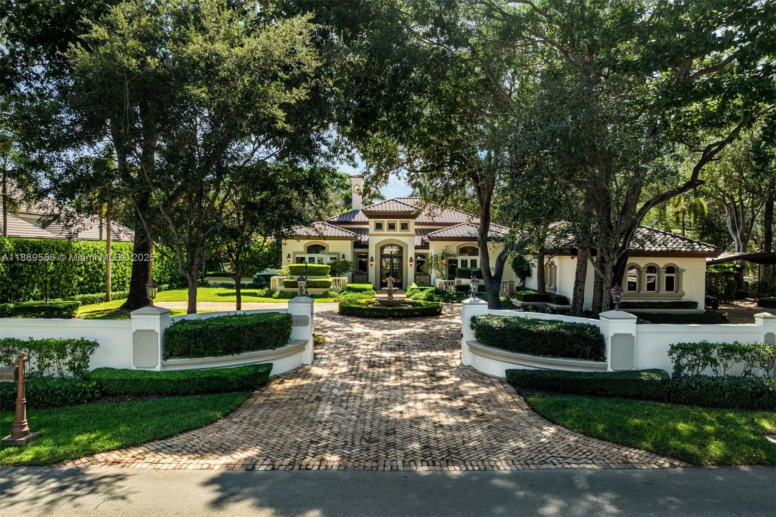 6350 Southwest 92nd Street Pinecrest, FL 33156 - Photo 35 of 41 a view of a house with garden and a trees
