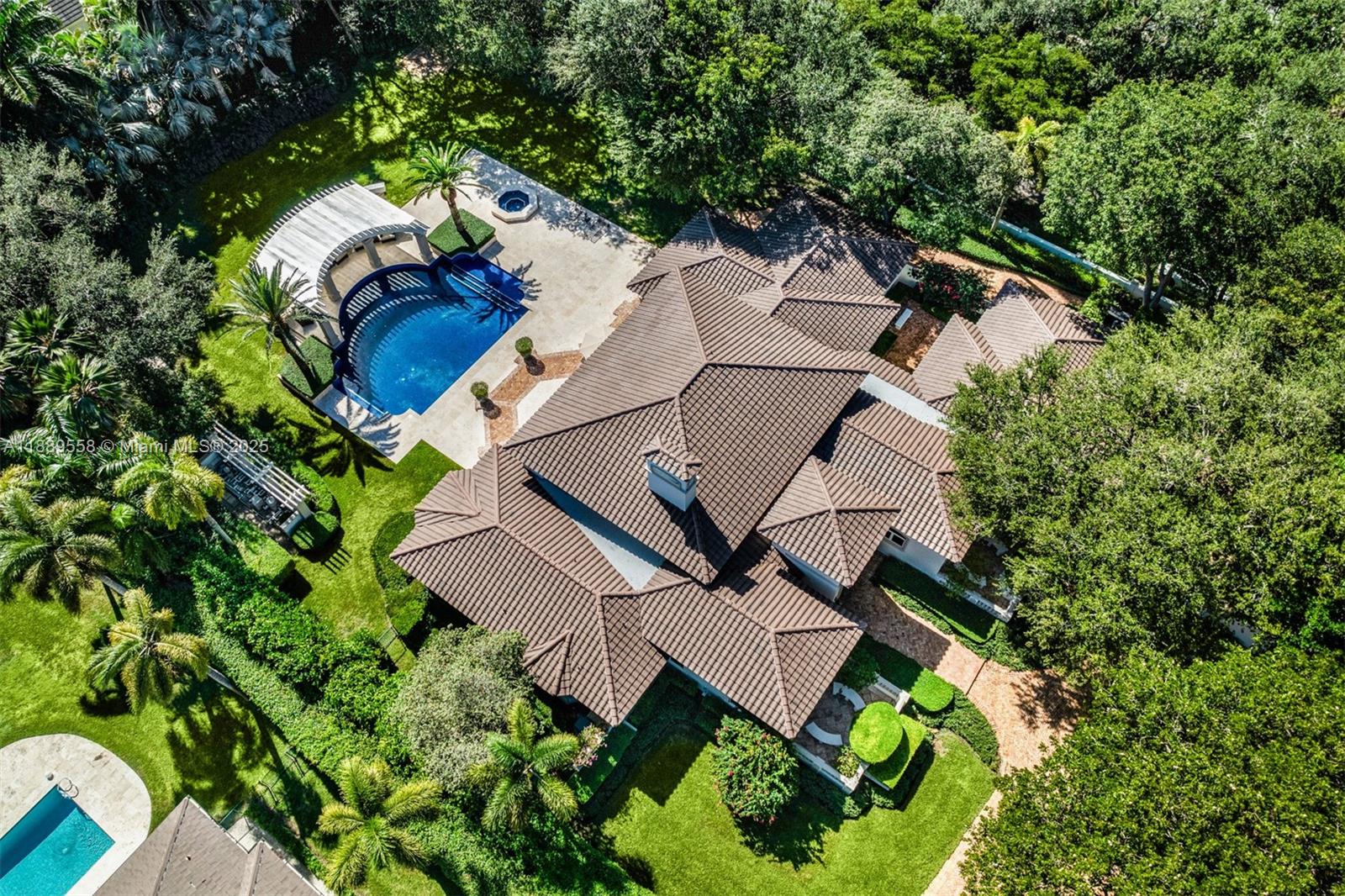 6350 Southwest 92nd Street Pinecrest, FL 33156 - Photo 37 of 41 an aerial view of a house with a yard