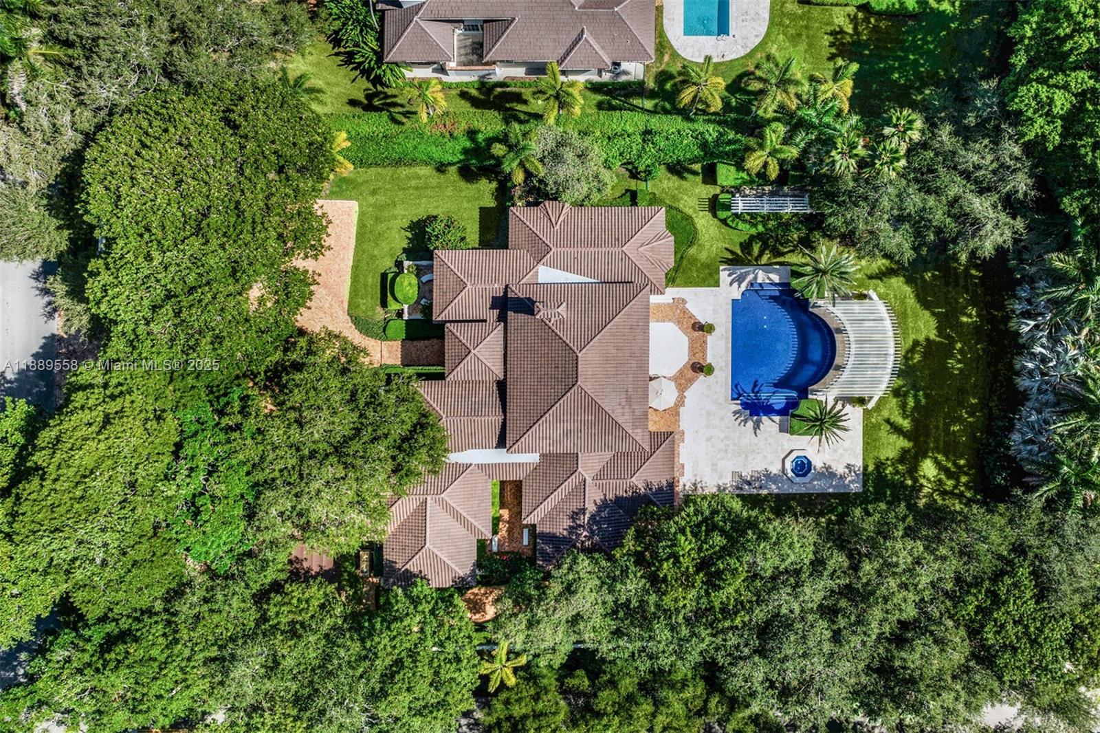 6350 Southwest 92nd Street Pinecrest, FL 33156 - Photo 38 of 41 an aerial view of a house with outdoor space and street view