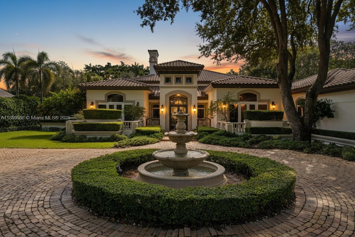 6350 Southwest 92nd Street Pinecrest, FL 33156 - Photo 39 of 41 a front view of a house with a garden