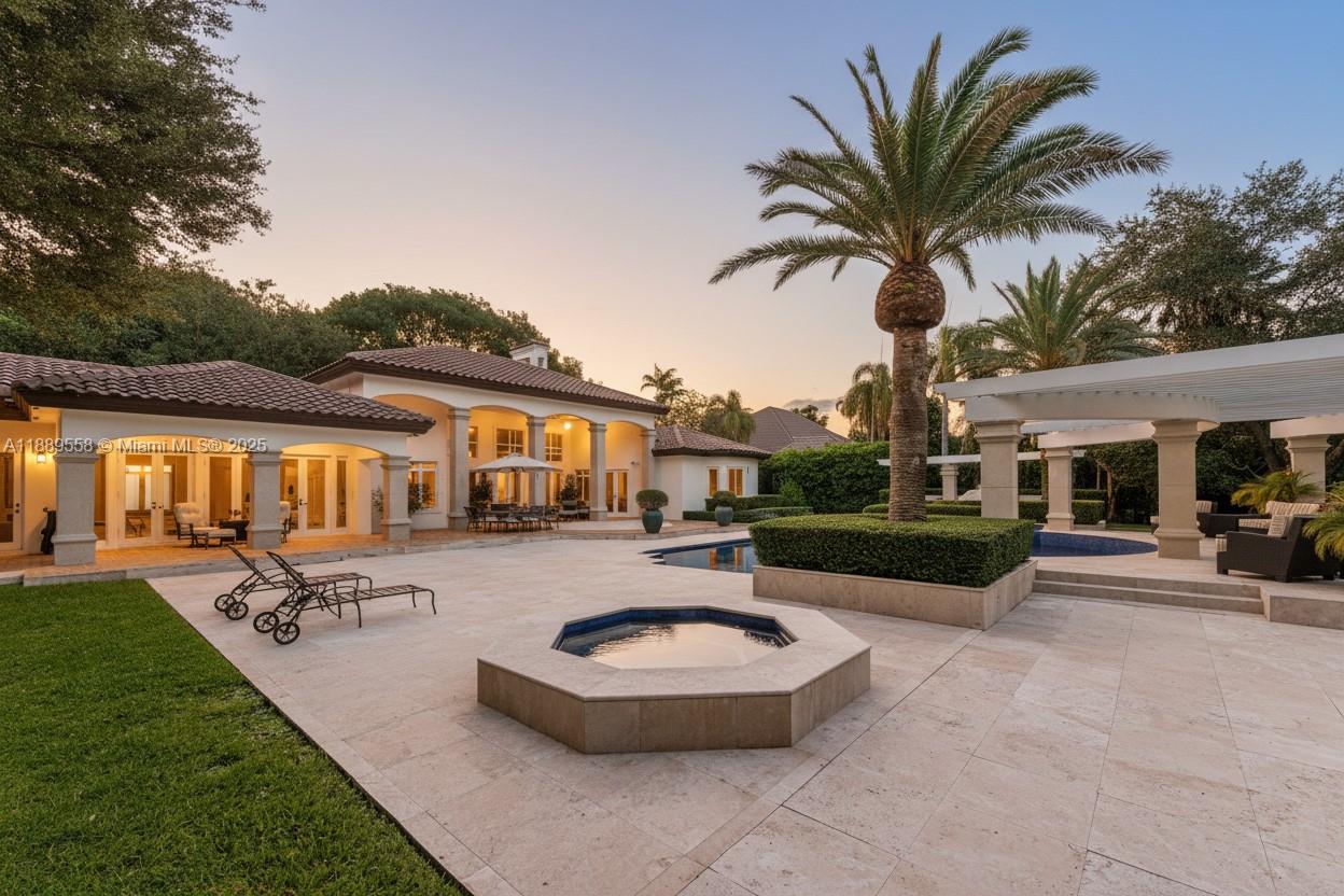 6350 Southwest 92nd Street Pinecrest, FL 33156 - Photo 41 of 41 a front view of a house with swimming pool table and chairs