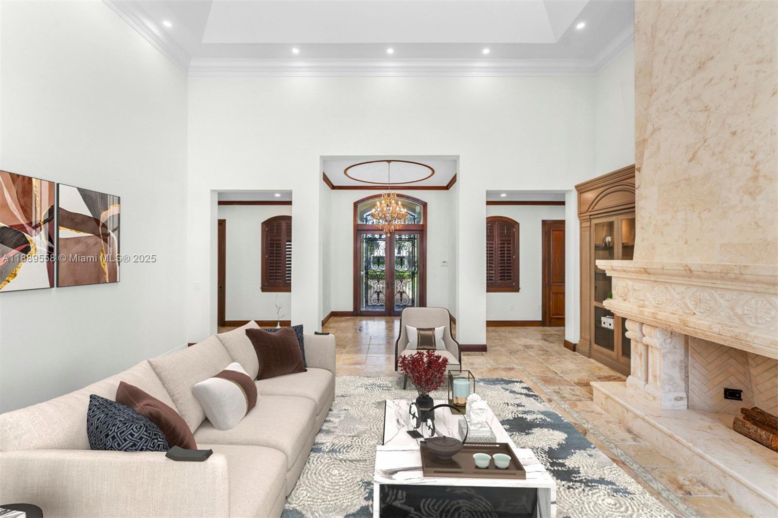 6350 Southwest 92nd Street Pinecrest, FL 33156 - Photo 6 of 41 a living room with furniture a rug and a fireplace