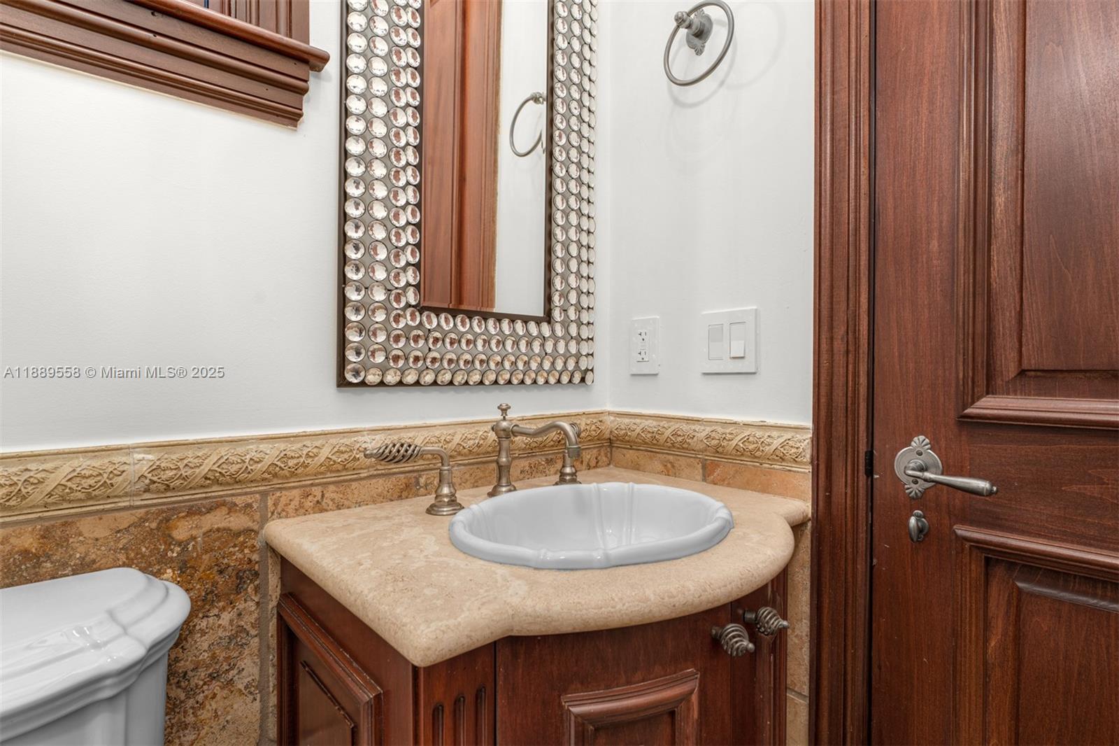 6350 Southwest 92nd Street Pinecrest, FL 33156 - Photo 7 of 41 a bathroom with a sink and a mirror
