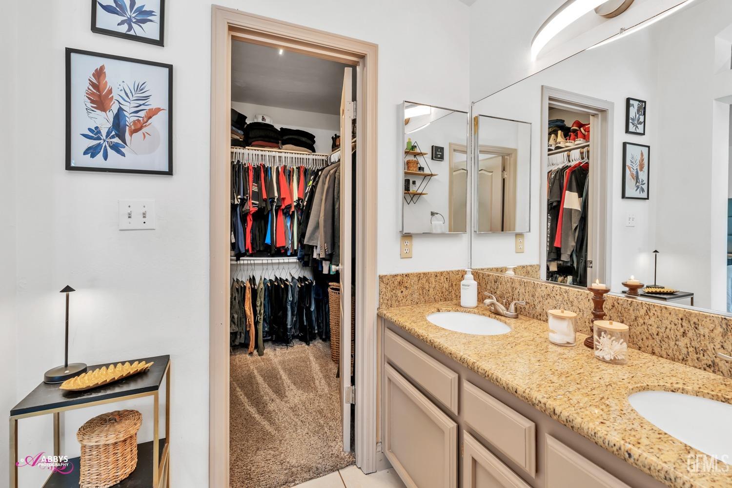 Undisclosed Address Bakersfield, CA 93312 - Photo 15 of 30 a bathroom with a sink and a mirror