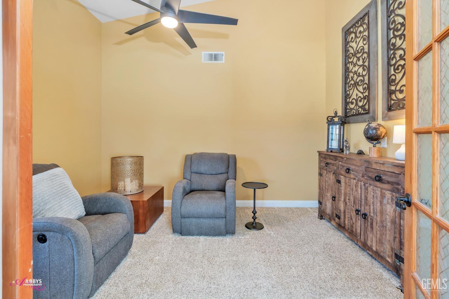Undisclosed Address Bakersfield, CA 93312 - Photo 16 of 30 a living room with furniture and a rug